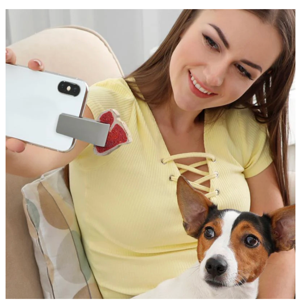 Photo of woman taking a selfie with her dog